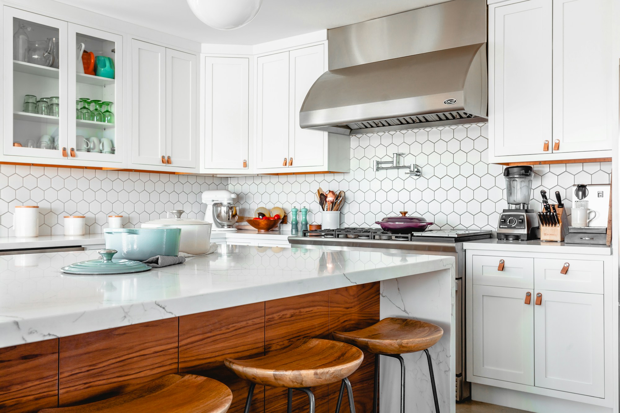 Kitchen inspiration featuring bright white cabinet doors and warm wood details